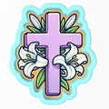 a cross with lilies and leaves on it