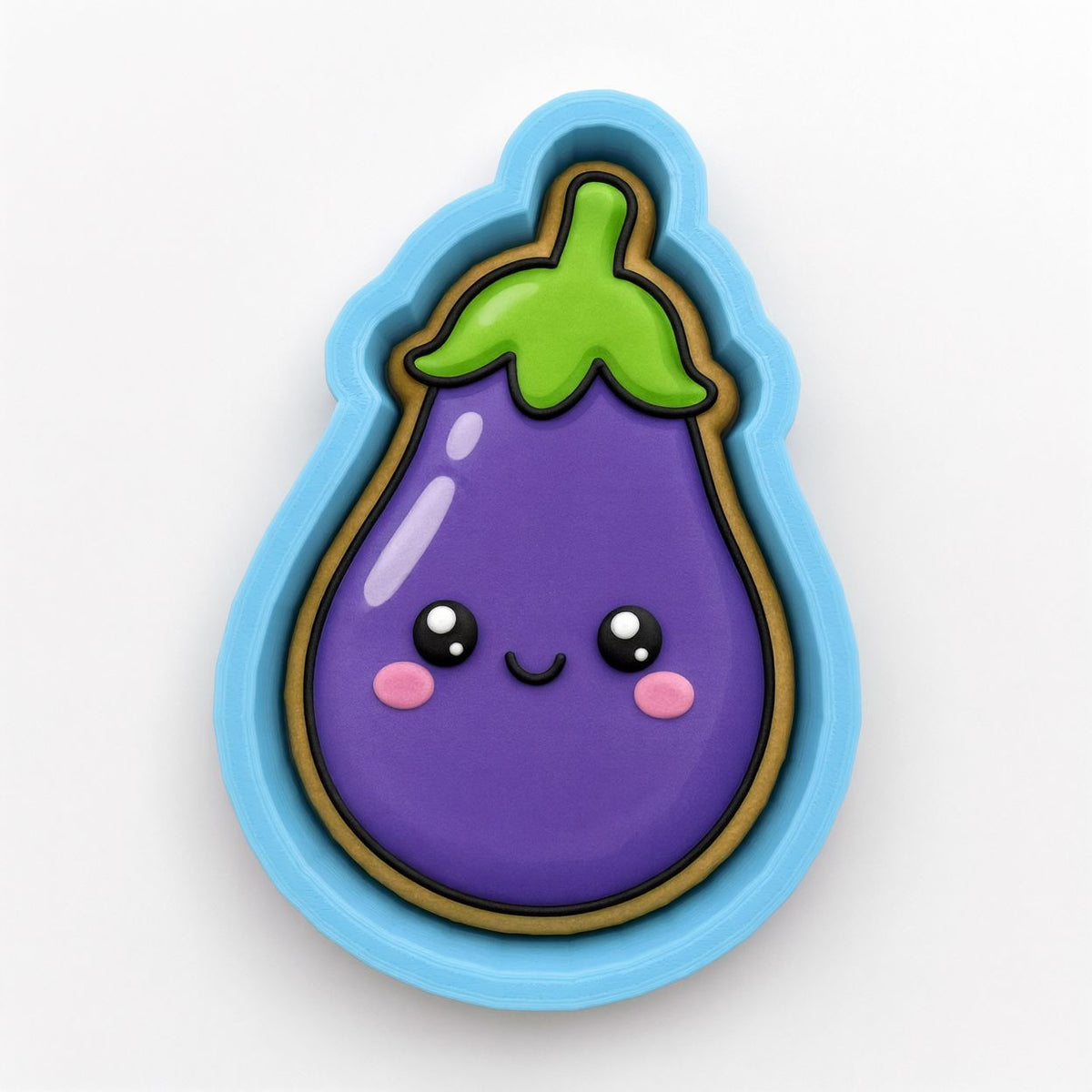 A purple eggplant cookie cutter with a smiling face and a green stem.
