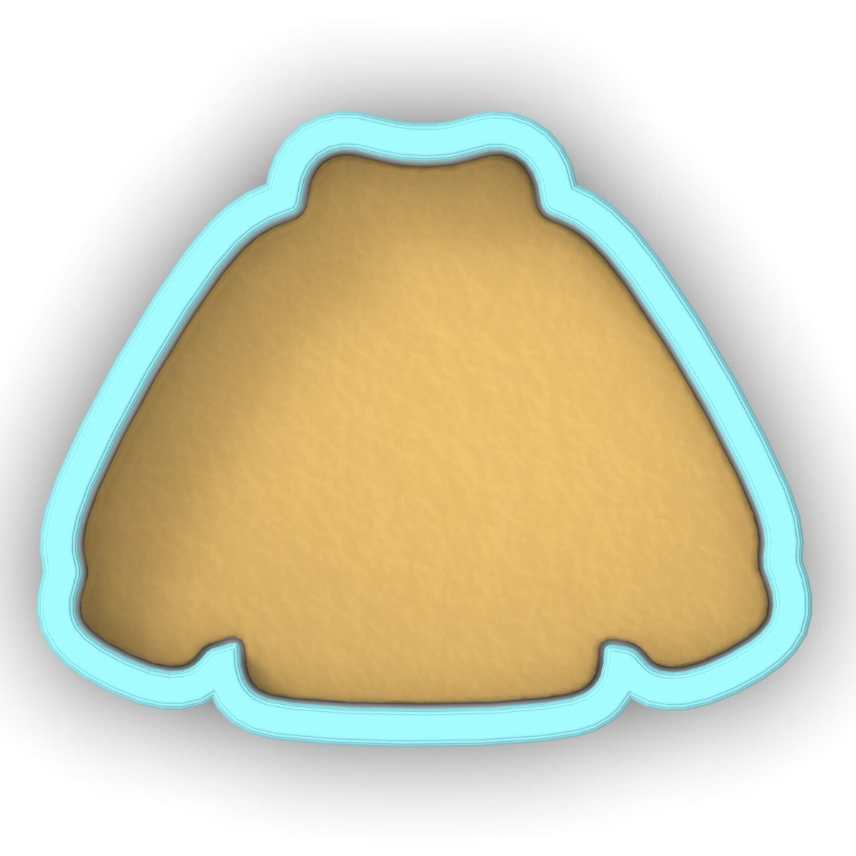 a cookie shaped cookie cutter sitting on top of a table