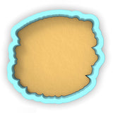 a cookie cutter with a cookie in the shape of a cookie