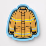 A cookie cutter in the shape of a fireman's uniform, with yellow and gray stripes.