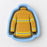 A cookie cutter in the shape of a fireman's uniform, with yellow and gray stripes.