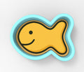 A yellow fish-shaped cookie cutter with a blue border.
