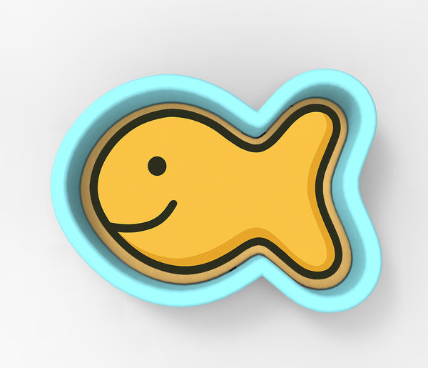 A yellow fish-shaped cookie cutter with a blue border.