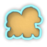 a cookie shaped like a teddy bear on a white background