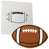 a cookie shaped like a football next to a cookie board