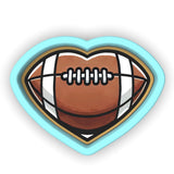 a heart shaped sticker with a football on it