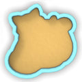 a cookie shaped like a bear on a white background