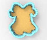 A cookie cutter in the shape of a dog's head, with a light brown color and a blue outline.