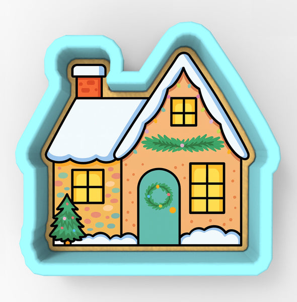 A cookie cutter-shaped illustration of a house with a wreath on the door, decorated for the Christmas season.