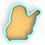 a cookie shaped like a hand with a thumb on it