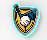 A golf club and ball are depicted within a shield-shaped cookie cutter.