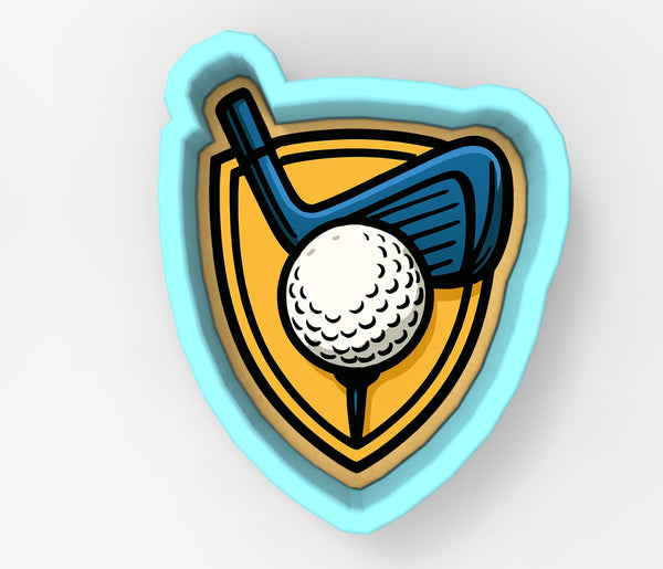 A golf club and ball are depicted within a shield-shaped cookie cutter.