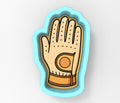 A hand wearing a glove with a hole in the palm.