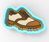 A cartoon illustration of a brown and white shoe with spikes on the bottom.