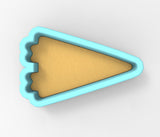 A blue and yellow triangular cookie cutter is shown against a white background.