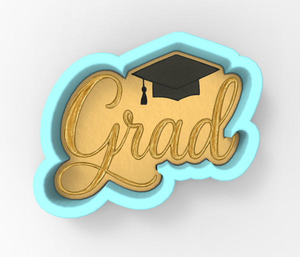 a blue and gold graduation cap with the word grad on it