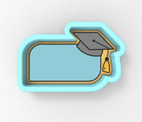 a graduation cap and tassel hanging from a wall