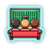 a group of people sitting on top of a couch