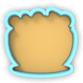 a cookie cutter with a cookie in the shape of a vase