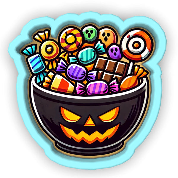 a bowl of candy with a jack - o - lantern face