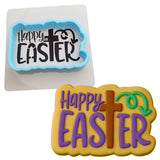 a cookie shaped like a cross and a happy easter cookie