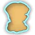 a cookie cutter with a cookie shaped like a face