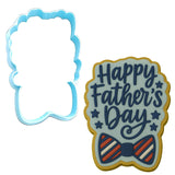 a cookie cutter and a cookie shaped like a father&#39;s day cookie