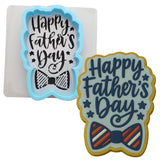 a cookie with a happy father&#39;s day cookie cutter next to a cookie with