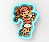 A cartoon illustration of a young girl playing golf, wearing a pink hat and a red shirt.