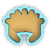 a cookie cutter with a cookie shaped like a hand