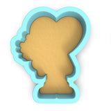 a cookie cutter with a silhouette of a woman's head