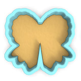 a cookie cutter with a butterfly shaped cookie