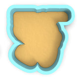 a cookie cutter with a cookie in the shape of a letter b
