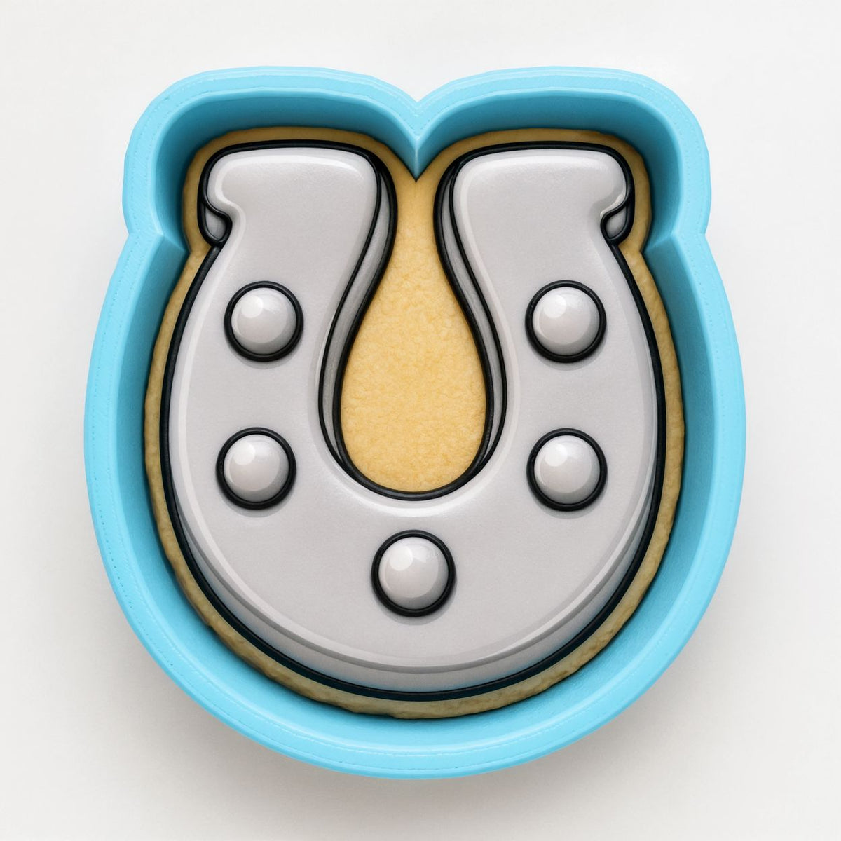 A blue cookie cutter shaped like a horseshoe, with a yellow interior.