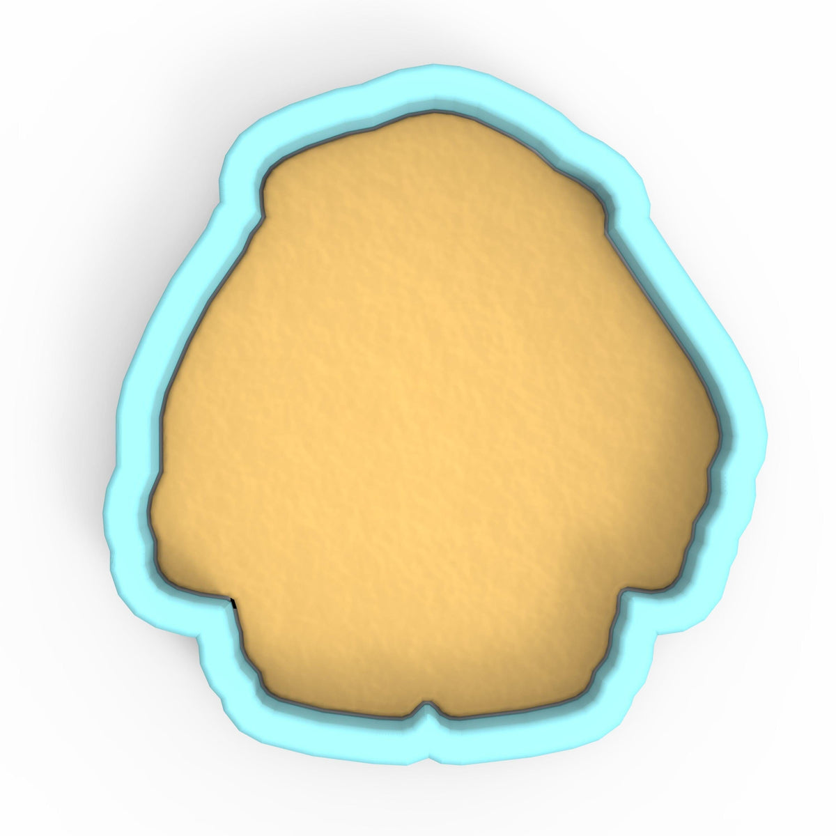a cookie cutter with a cookie in the shape of a face