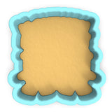 a cookie cutter with a cookie in the shape of a square