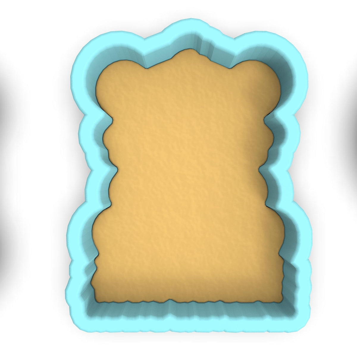 a cookie cutter with a piece of bread in it