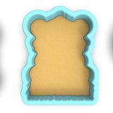 a cookie cutter with a piece of bread in it