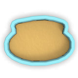 a cookie cutter with a cookie in the shape of a cookie