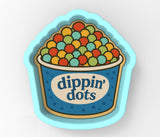 a bowl of dippin dots on a white background