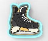 a skateboarder's shoe on top of a skateboard