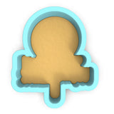 a cookie cutter with a cookie in the shape of the letter q