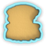 a cookie cutter with a cookie in the shape of a letter b