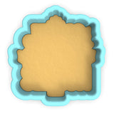 a cookie cutter with a cookie in the shape of a square