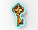 A 3D rendering of a golden key-shaped cookie cutter.