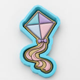 A colorful, diamond-shaped cookie cutter in the shape of a kite.