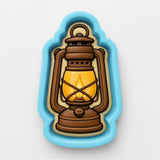 A lantern-shaped cookie cutter with a brown wooden lantern and a yellow light inside, set against a blue background.