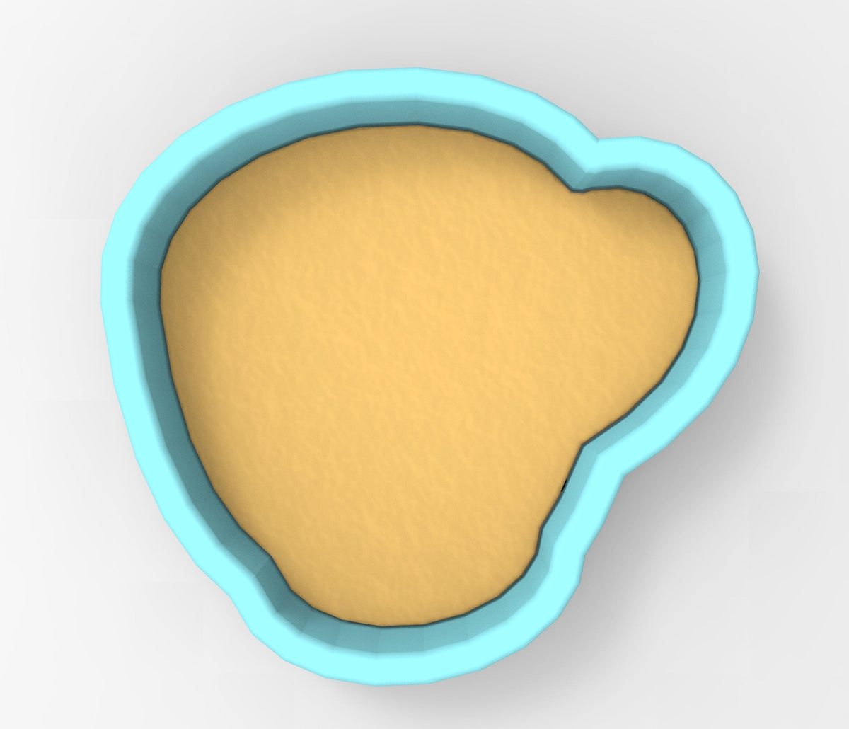 A blue bowl with a yellow substance inside it.