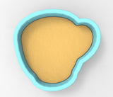 A blue bowl with a yellow substance inside it.